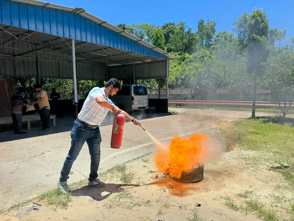 Fire safety training with extinguisher practice